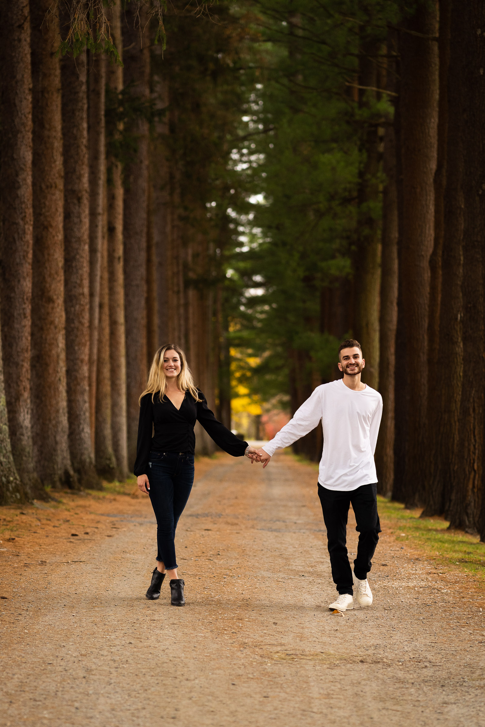 man and women holding hands on engagement session at Naumkeag