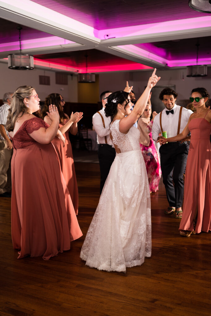 Proprietors Lodge wedding photography bride dancing pink lights
